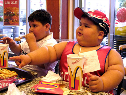 fat man eating burger. you#39;re eating McDonald#39;s